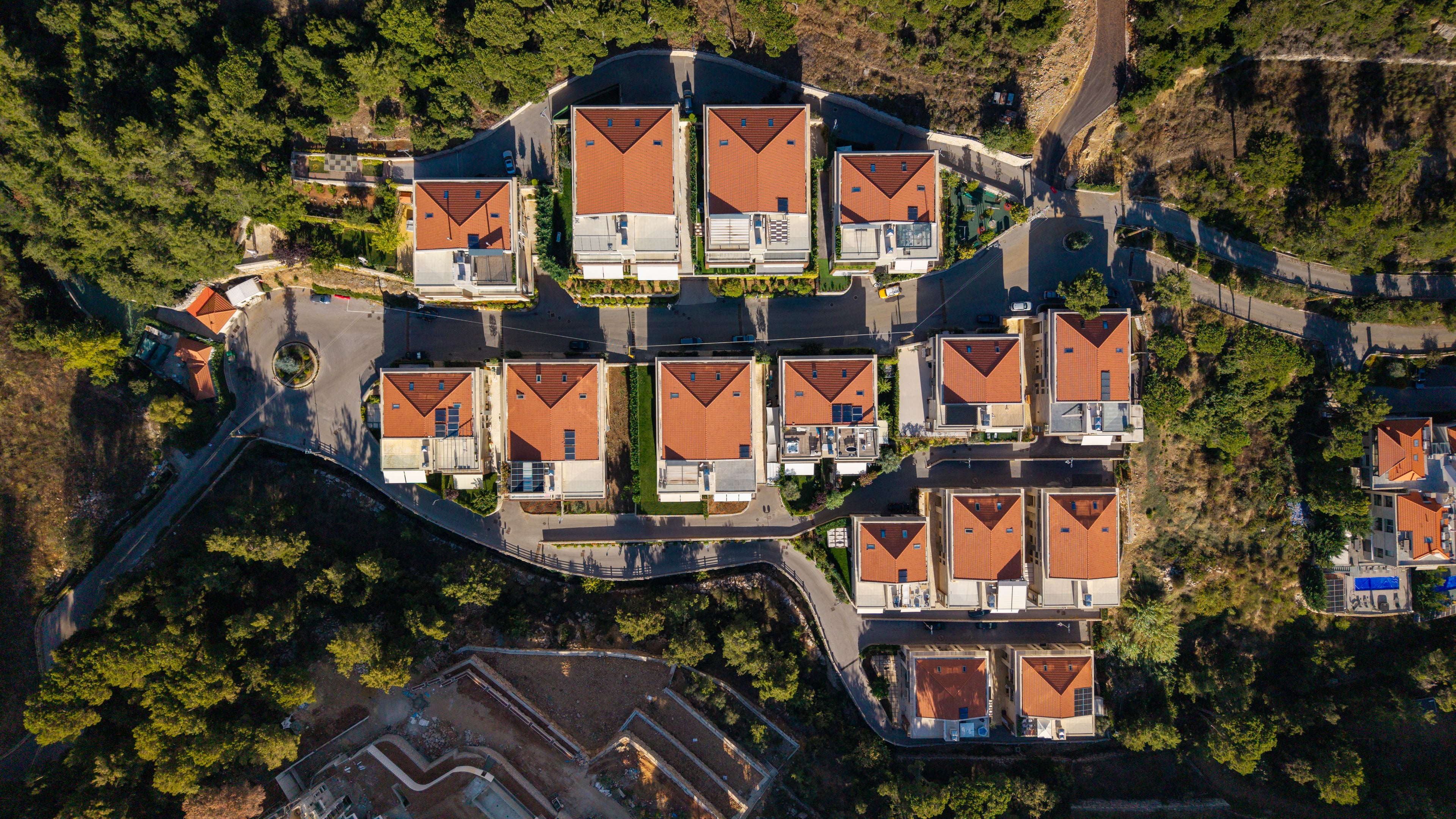 Aerial view of a Rahbani Developments residential community among pine trees in Lebanon